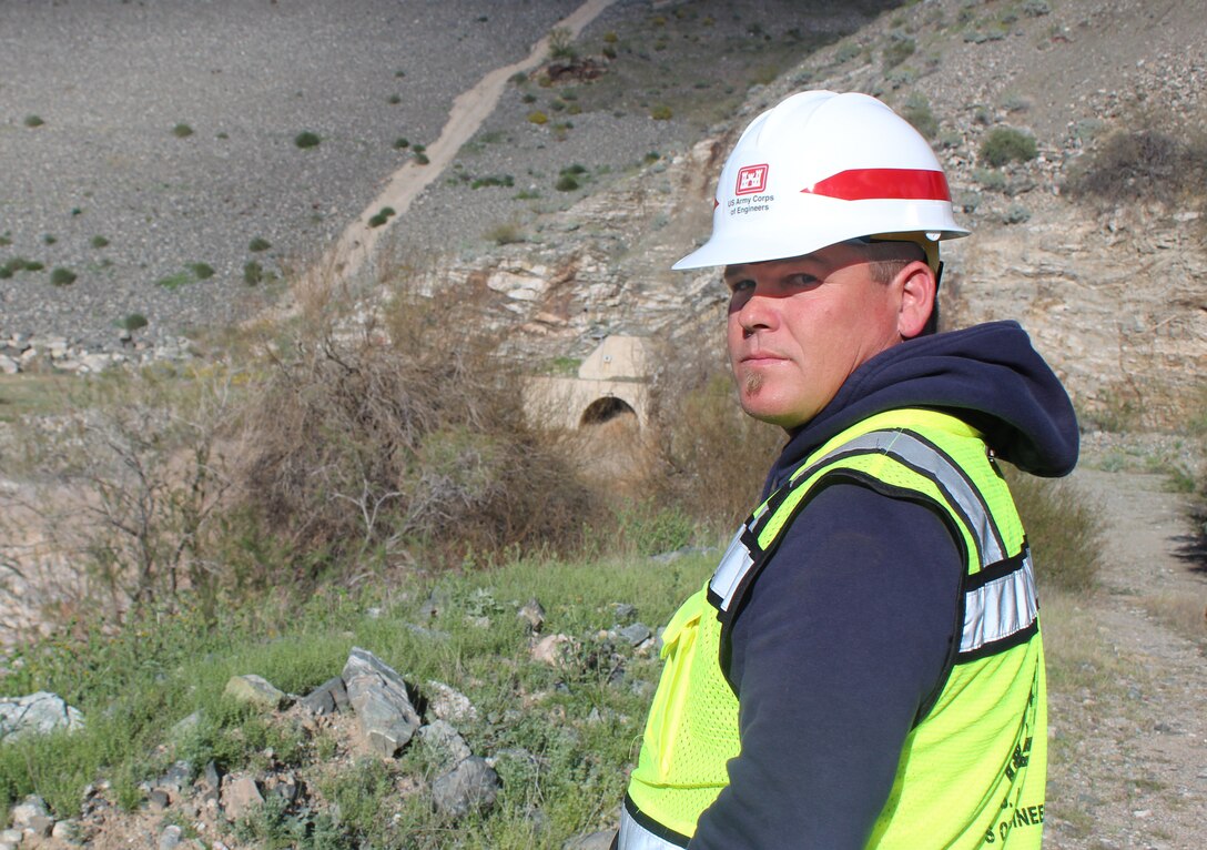 U.S. Army Corps of Engineers dam operator Matthew Ogden, from the Los Angeles District, reviews impacted areas from Alamo Dam’s high-water release March 23 at the Alamo Lake State Park in West Arizona. Due to recent storm events, the U.S. Army Corps of Engineers began a higher-than-normal water release to alleviate flood effects. The Alamo Dam project’s initial authorization included flood control and other purposes such as hydro-power generation, water conservation and recreation.