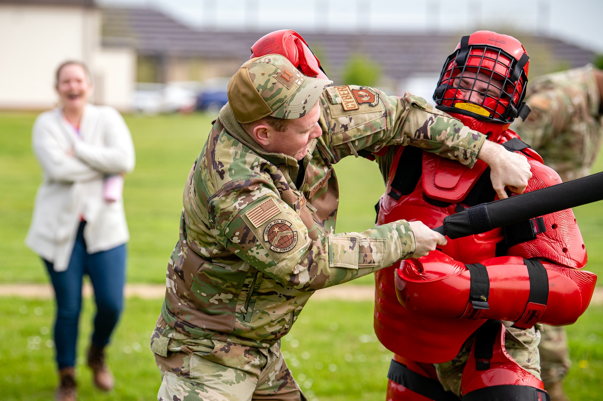 U.S. Air Force Senior Airman Ambrose Ross, right, demonstrates combatives with Capt. Nathaniel Osborne, 423d Communications Squadron flight commander at RAF Alconbury, England, May 18, 2023. The demonstration was a part of National Police Week where members from SFS engaged with and demonstrated police capabilities to students from Alconbury Elementary school. (U.S. Air Force photo by Staff Sgt. Eugene Oliver