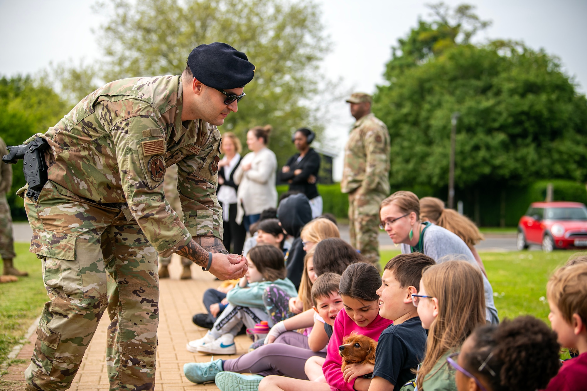 An Airman from the 423d Security Forces Squadron displays taser prongs following a demonstration at RAF Alconbury, England, May 18, 2023. The demonstration was a part of National Police Week where members from SFS engaged with and demonstrated police capabilities to students from Alconbury Elementary school. (U.S. Air Force photo by Staff Sgt. Eugene Oliver)