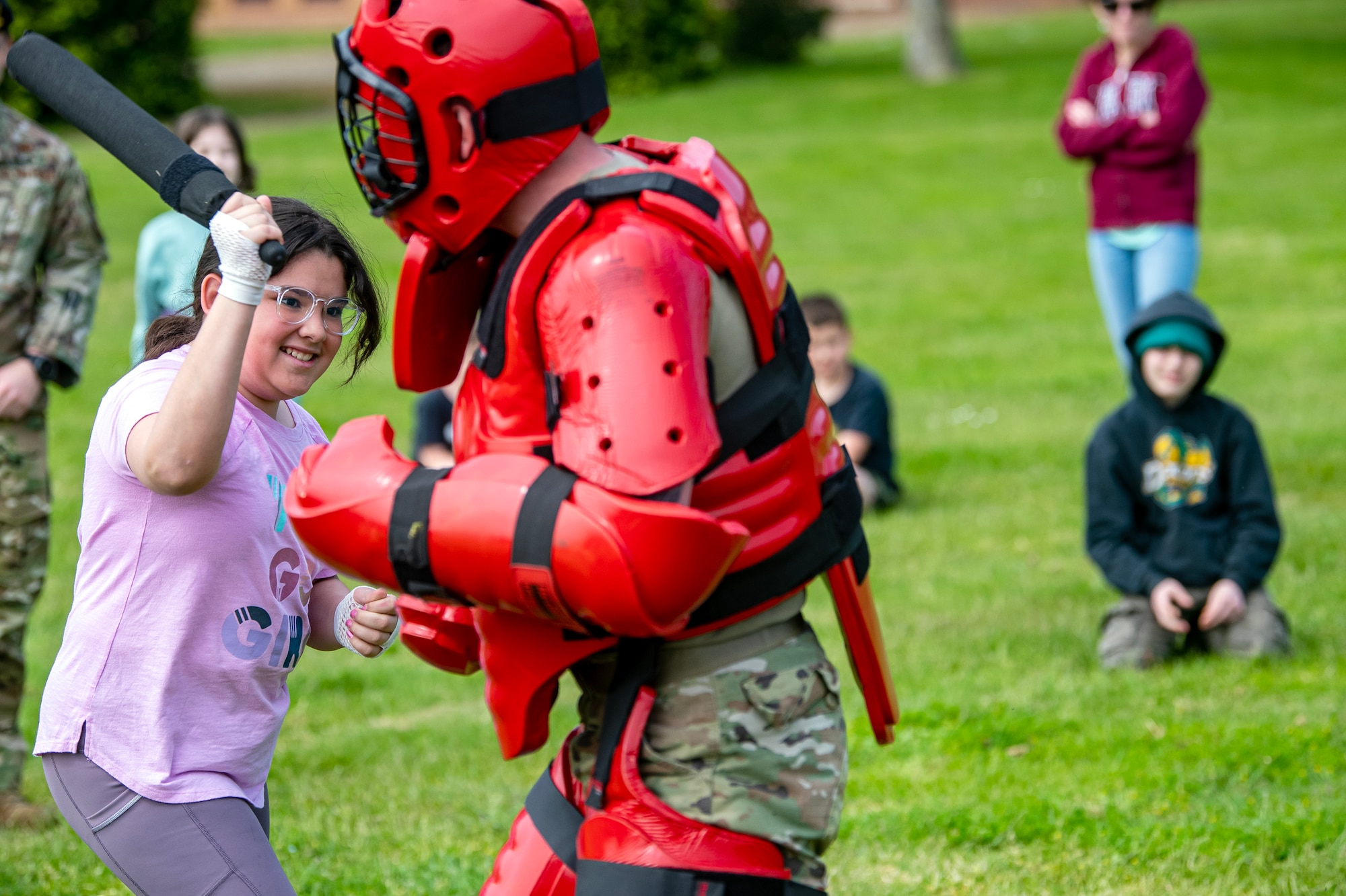 An Alconbury elementary school student demonstrates combatives with a member from the 423d Security Forces Squadron at RAF Alconbury, England, May 18, 2023. As part of National Police Week students were able to engage with members and learn more about the capabilities of the 423d SFS. (U.S. Air Force photo by Staff Sgt. Eugene Oliver)