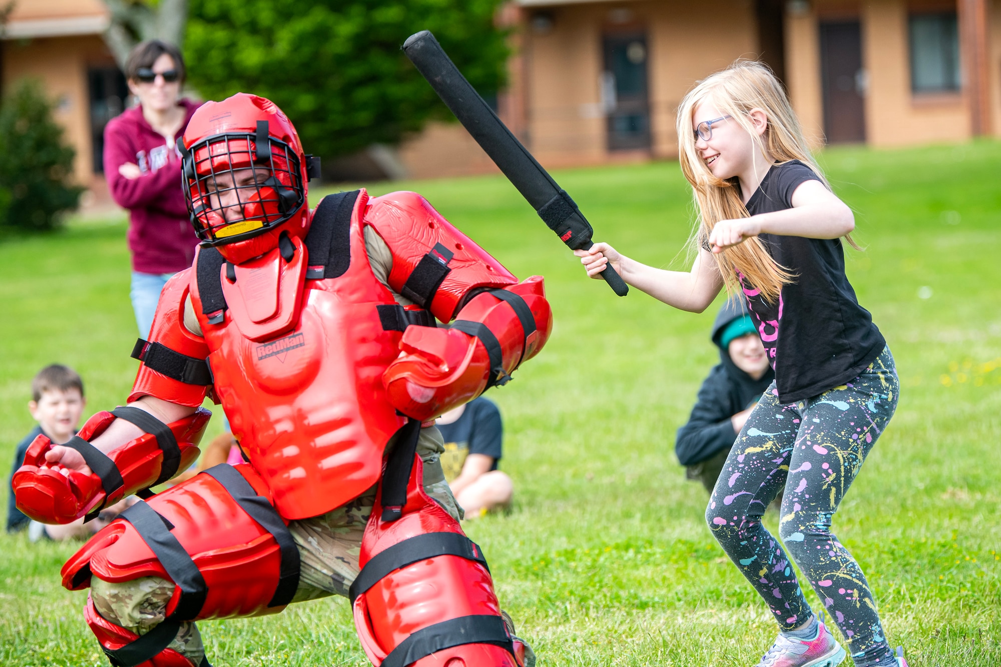 An Alconbury elementary school student demonstrates combatives with a member from the 423d Security Forces Squadron at RAF Alconbury, England, May 18, 2023. As part of National Police Week students were able to engage with members and learn more about the capabilities of the 423d SFS. (U.S. Air Force photo by Staff Sgt. Eugene Oliver)