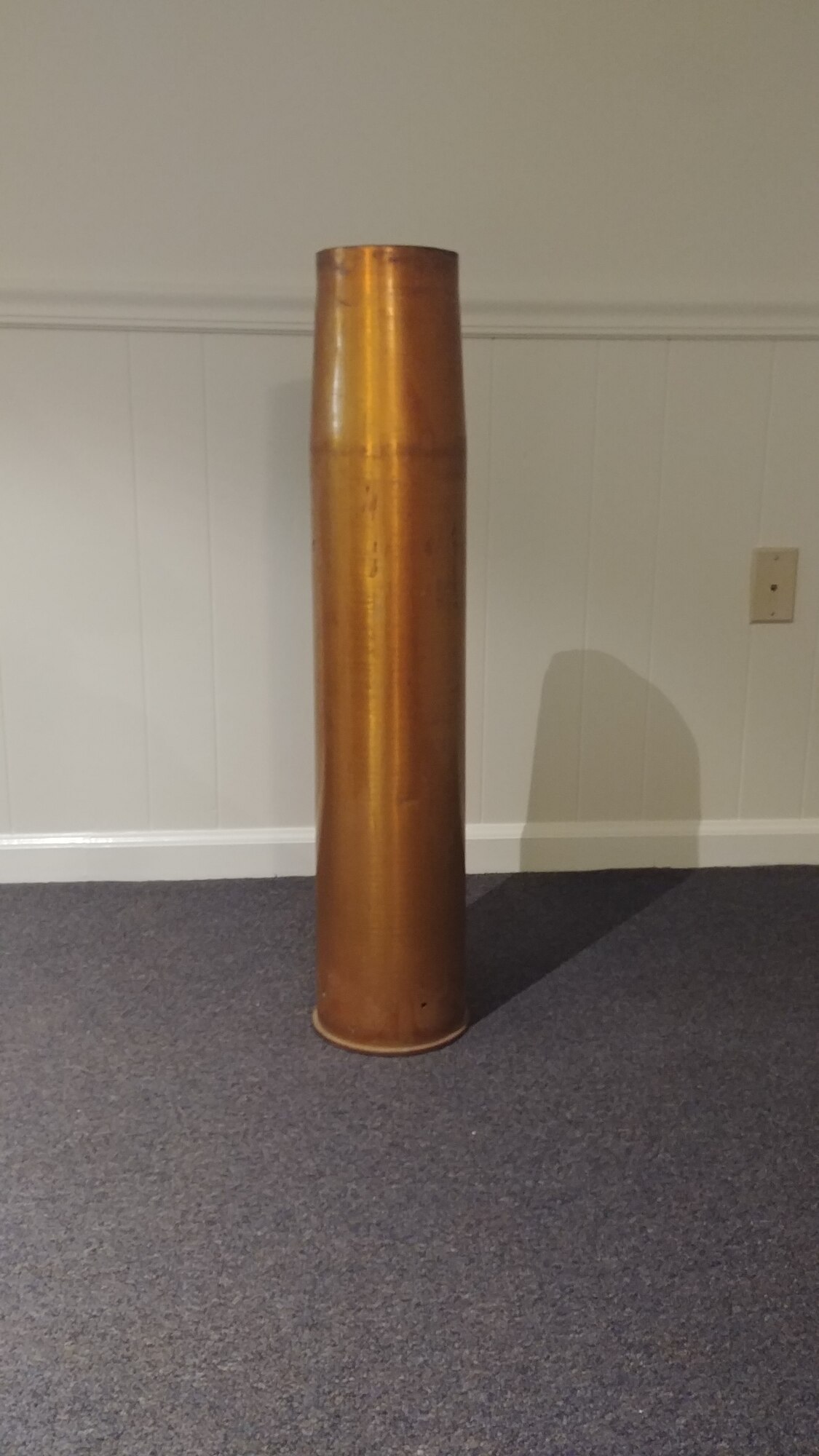 A brass casing from a 130 mm shell