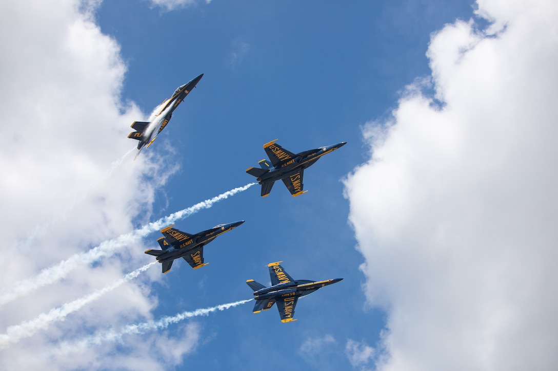 Four military jets fly in formation.