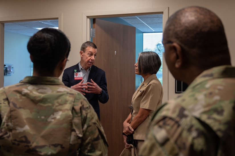 U.S. Navy Rear Adm. Tracy Farrill, Deputy Director of the Small Market and Stand-Alone Medical Treatment Facility Organization for the Defense Health Agency and U.S. Air Force Chief Master Sgt. Paul Ellis, the senior enlisted advisor to SSO for DHA receive a tour around Deborah Heart and Lung Center during their visit at Joint Base McGuire-Dix-Lakehurst, N.J., May 17, 2023. Members from DHA visited to gain perspective on the unique capabilities and mission of the joint base.