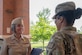 U.S. Navy Rear Adm. Tracy Farrill, Deputy Director of the Small Market and Stand-Alone Medical Treatment Facility Organization for the Defense Health Agency greets U.S. Air Force Col. Bridget Gill, 87th Medical Group Commander at Joint Base McGuire-Dix-Lakehurst, N.J., May 17, 2023. Members from DHA visited to gain perspective on the unique capabilities and mission of the joint base.