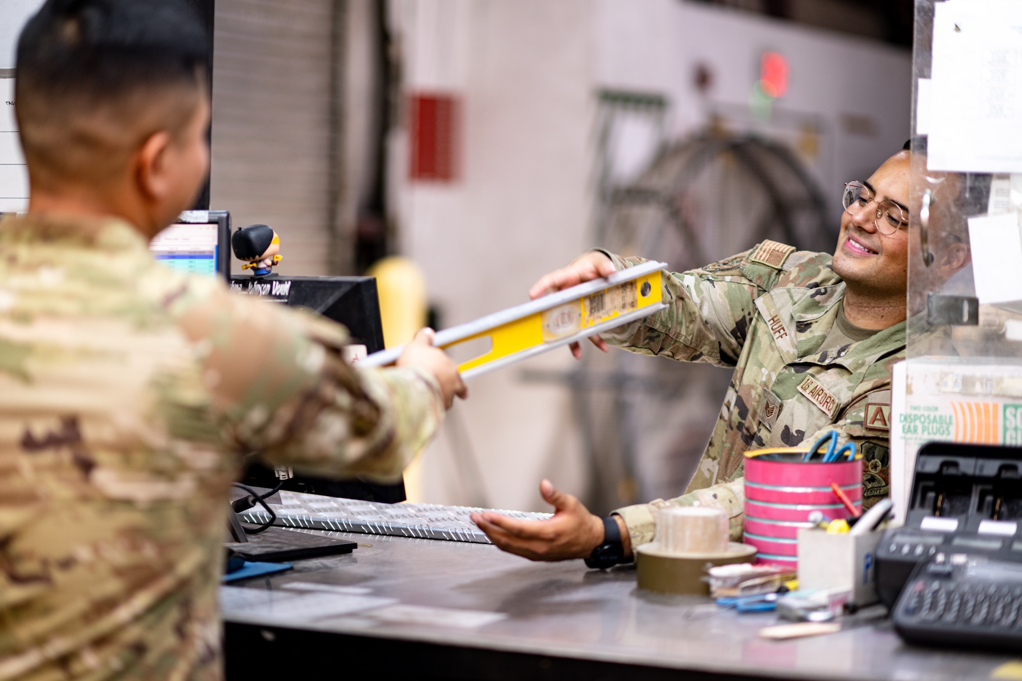 Photo of two Airmen interacting with each other