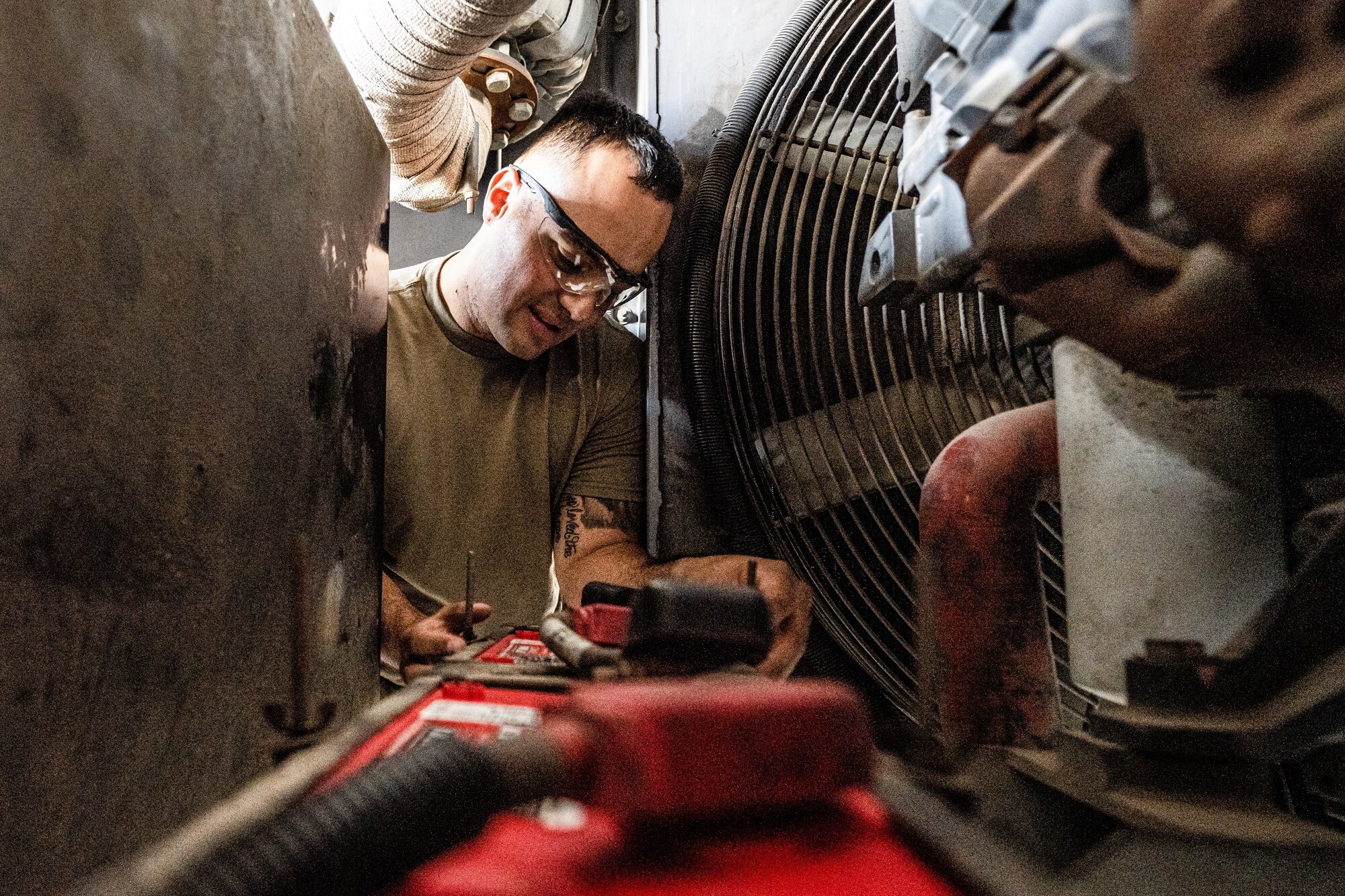 Photo of an Airman performing maintenance