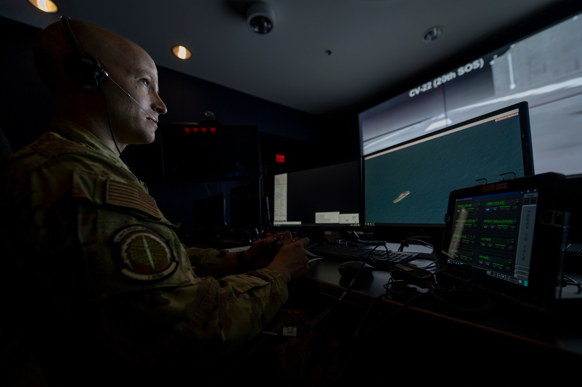 An AC-130J weapons systems officer prepares for the joint virtual simulation training event as part of the annual Emerald Warrior exercise at Hurlburt Field, Florida, April 26, 2023.