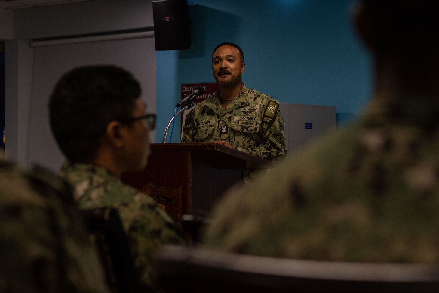 Logistics Specialist 1st Class Earl Satcher, assigned to Naval Support Activity Souda Bay, talks about his Filipino culture and how it translates to the fundamentals of the U.S. Navy during an Asian American Pacific Islander Heritage Month celebration in The Anchor on May 11, 2023.