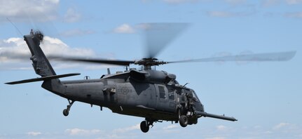 A New York Air National Guard HH-60G Pave Hawk helicopter assigned to the 106th Rescue Wing provides security and is prepared for combat rescue operations over Warren Grove, N.J., May 6, 2023. New York Air National Guard members trained with Massachusetts Army National Guard Special Forces personnel, simulating combat rescue of a friendly casualty.