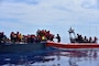 Haitians are transferred from a grossly overloaded, unsafe vessel to Coast Guard Cutter Campbell's small boat approximately 20 miles south of Turks and Caicos