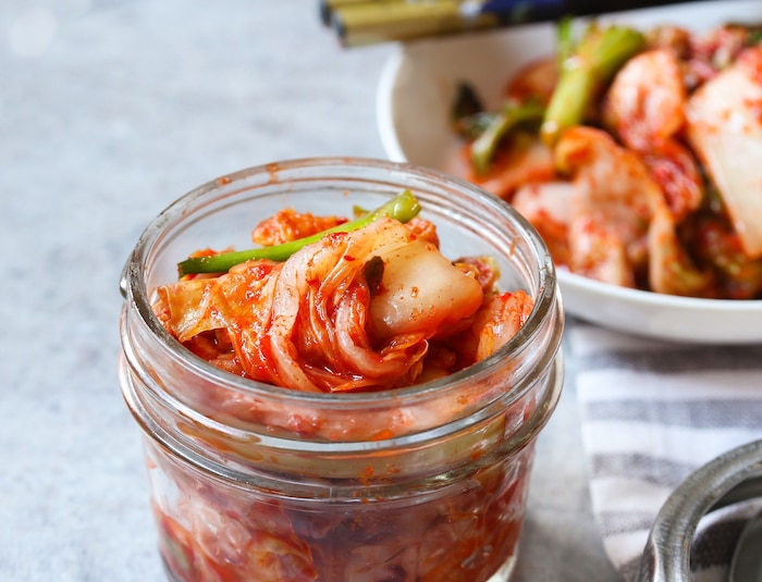 Close up of homemade kimchi cabbage in a jar. Photo: © vm2002/stock.adobe.com [image is not public domain]