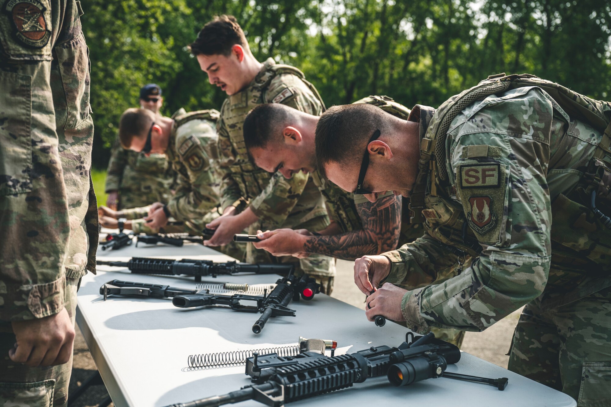 Airmen assemble a weapon during the Defender Challenge
