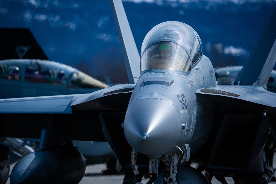 U.S. Navy pilots prepare to take flight in an EA-18G “Growler,” assigned to Electronic Attack Squadron (VAQ) 132, during Northern Edge 23-1 at Joint Base Elmendorf-Richardson, Alaska, May 8, 2023. NE 23-1 is a strong example of multilateral cooperation and stands in stark contrast to other examples in the regions, which challenge the international rules-based order through expansive and assertive security actions. (U.S. Air Force photo by Airman 1st Class William Rodriguez)