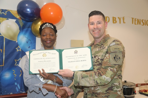 Valjean Stell-Burns, chief of the Internal Review Office, U. S. Army Corps of Engineers, Savannah District receives a Certificate of Retirement from Savannah District Deputy Commander Lt. Col. Alex Duffy, May 16, during her retirement ceremony. Stell-Burns officially retires June 3 after 42 years of federal service.