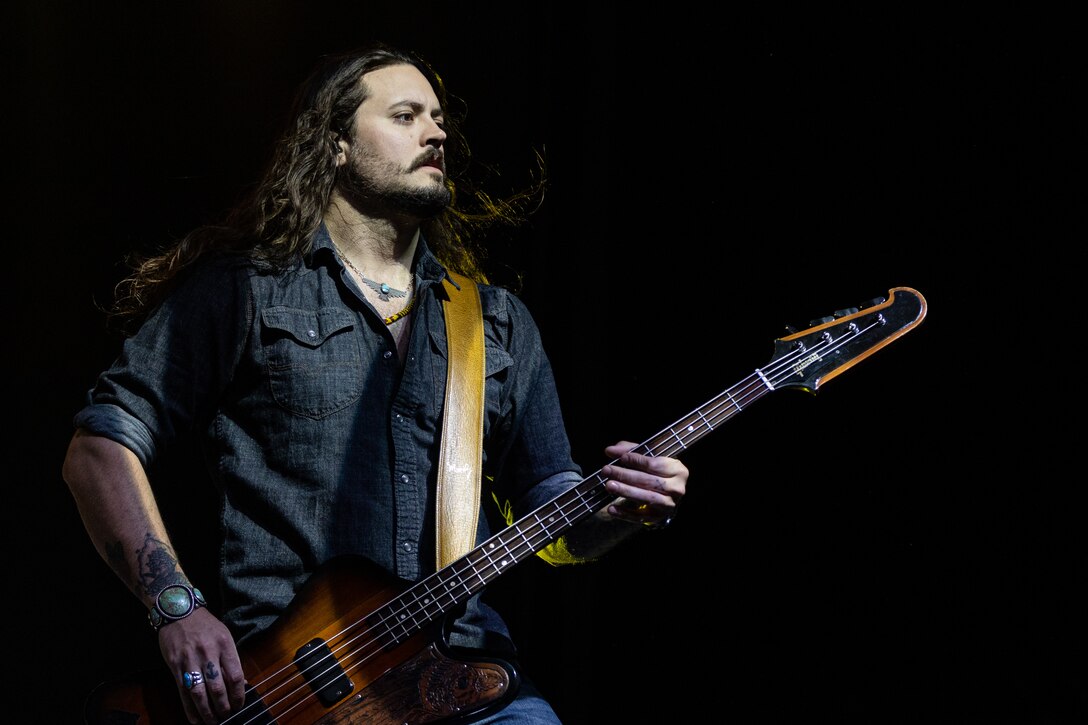 3 Doors Down bassist, Justin Biltonen, plays the bass during the We Salute You Celebration at Victory Field at Marine Corps Air-Ground Combat Center, Twentynine Palms, California, May 6, 2023. Grammy-nominated rock band 3 Doors Down headlined this annual Marine Corps Community Services sponsored event meant to honor Combat Center service members and their families by providing food, activities and live entertainment. (U.S. Marine Corps photo by Lance Cpl. Richard PerezGarcia)