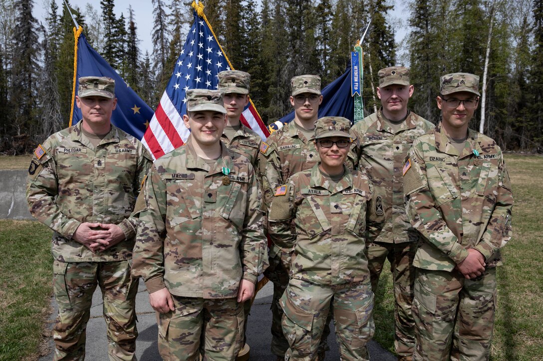 Command Sgt. Maj. John Phlegar, left, the state command sergeant major of the Alaska Army National Guard, pins the Army Commendation Medal on the 2023 Soldier of the Year, Spc. Adam Macro, a military police Soldier from Alpha Company, 49th Missile Defense Battalion during the Best Warrior Competition awards ceremony held at Camp Carroll, Alaska, May 21, 2023. Throughout the week of May 16, 2023, the Best Warrior Competition tested Soldiers on their physical and mental readiness as well as their knowledge of Army doctrine and common warrior tasks.