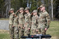 Command Sgt. Maj. John Phlegar, left, the state command sergeant major of the Alaska Army National Guard, pins the Army Commendation Medal on the 2023 Soldier of the Year, Spc. Adam Macro, a military police Soldier from Alpha Company, 49th Missile Defense Battalion during the Best Warrior Competition awards ceremony held at Camp Carroll, Alaska, May 21, 2023. Throughout the week of May 16, 2023, the Best Warrior Competition tested Soldiers on their physical and mental readiness as well as their knowledge of Army doctrine and common warrior tasks.