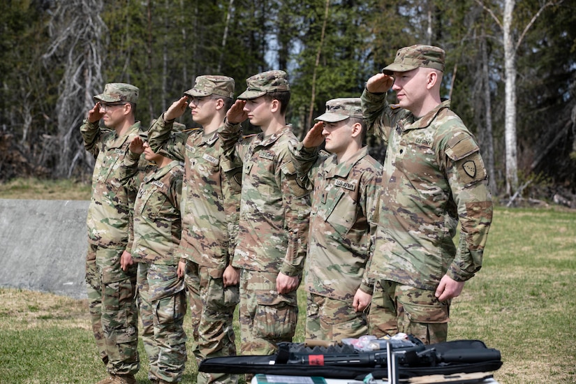 Command Sgt. Maj. John Phlegar, left, the state command sergeant major of the Alaska Army National Guard, pins the Army Commendation Medal on the 2023 Soldier of the Year, Spc. Adam Macro, a military police Soldier from Alpha Company, 49th Missile Defense Battalion during the Best Warrior Competition awards ceremony held at Camp Carroll, Alaska, May 21, 2023. Throughout the week of May 16, 2023, the Best Warrior Competition tested Soldiers on their physical and mental readiness as well as their knowledge of Army doctrine and common warrior tasks.