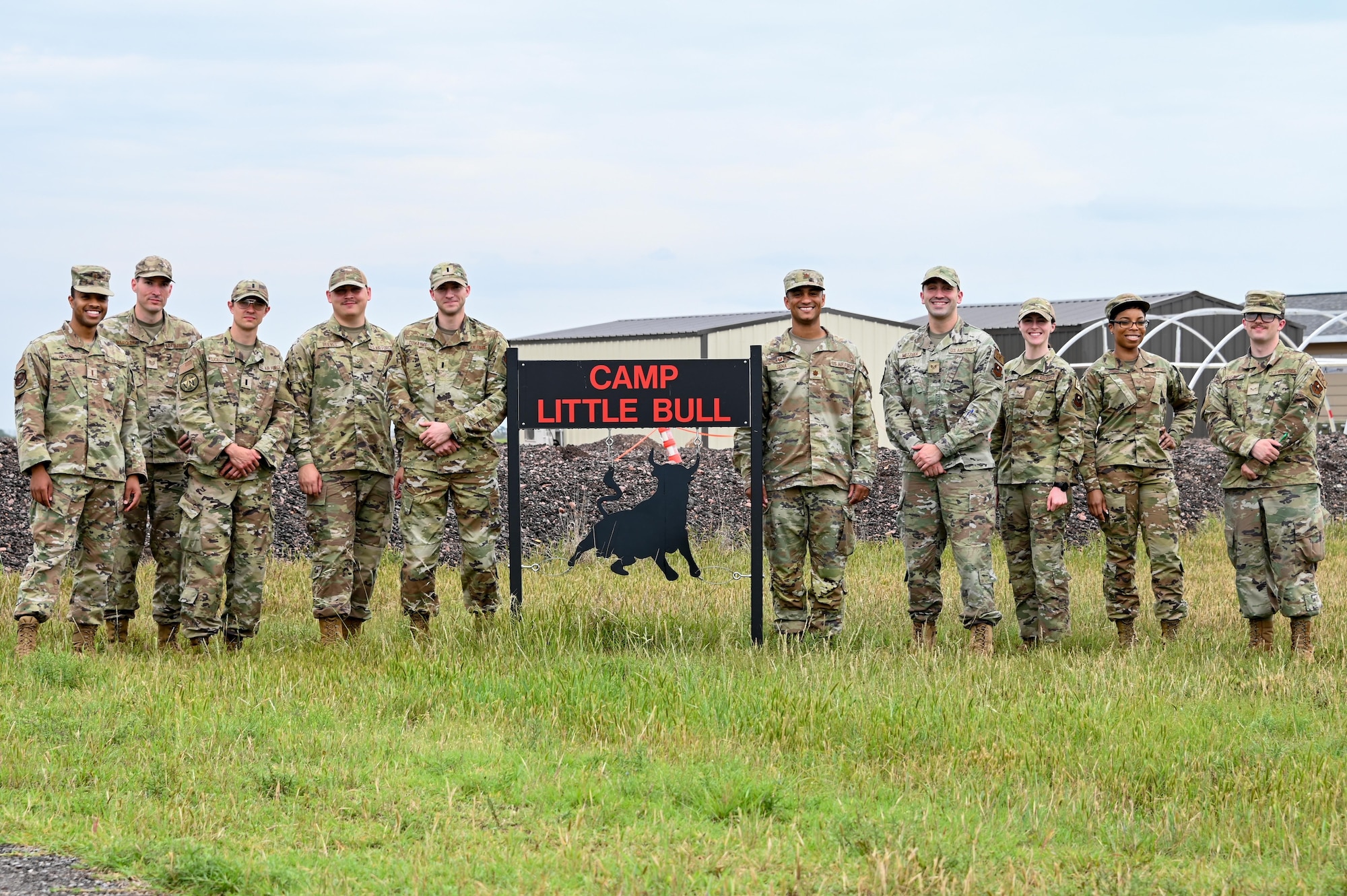 Airmen from the 97th Contracting Squadron and 71st Contracting Flight, Vance Air Force Base (AFB), Oklahoma, pose for a group photo at Altus AFB, May 18, 2023. The two contracting teams worked together to simulate deployment situations and enhance their expeditionary skills (U.S. Air Force photos by Senior Airman Kayla Christenson)