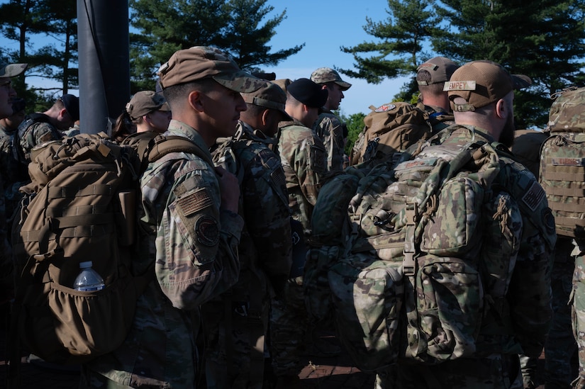 Airmen prepare to ruck during the opening ceremony for Police Week at Joint Base McGuire-Dix-Lakehurst, N.J. May 15, 2023. National Police Week is observed annually, and it honors the courageous law enforcement officers who made the ultimate sacrifice in the line of duty, while ensuring the safety and protection of others. (U.S. Air Force -photo by Senior Airman Faith Iris MacIlvaine)