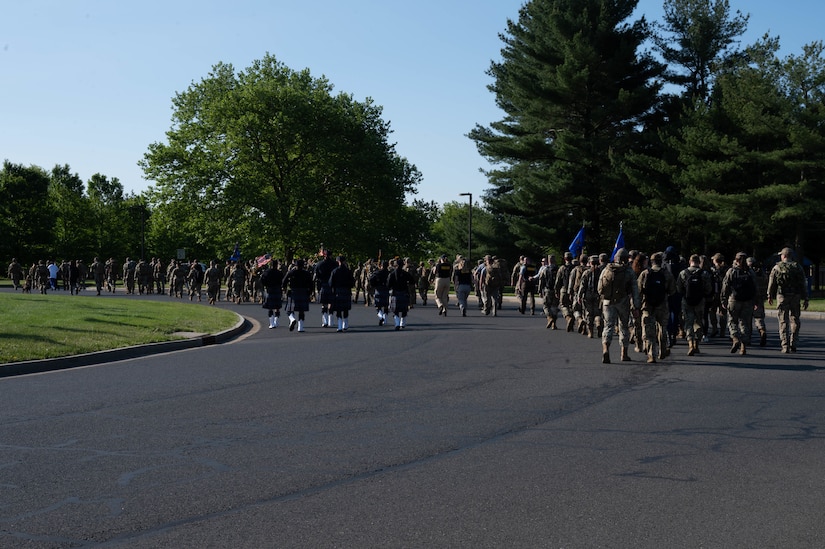 Airmen begin their ruck after the opening ceremony during Police Week at Joint Base McGuire-Dix-Lakehurst, N.J. May 15, 2023. National Police Week is observed annually, and it honors the courageous law enforcement officers who made the ultimate sacrifice in the line of duty, while ensuring the safety and protection of others. (U.S. Air Force photo by Senior Airman Faith Iris MacIlvaine)