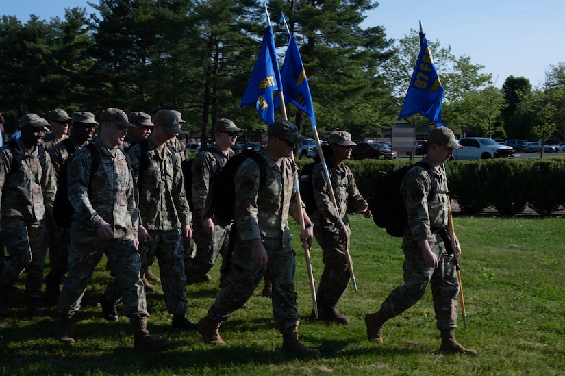 Airmen start their ruck after the opening ceremony during Police Week at Joint Base McGuire-Dix-Lakehurst, N.J. May 15, 2023. National Police Week is observed annually, and it honors the courageous law enforcement officers who made the ultimate sacrifice in the line of duty, while ensuring the safety and protection of others. (U.S. Air Force photo by Senior Airman Faith Iris MacIlvaine)