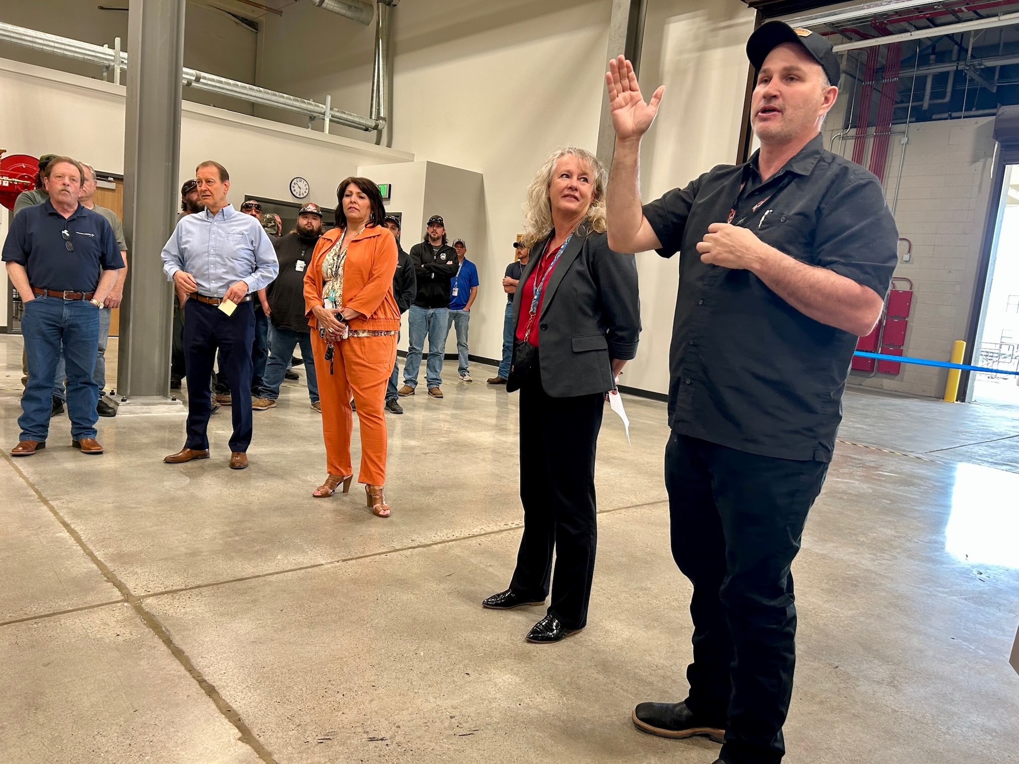 a supervisor addresses the crowd at a ceremony