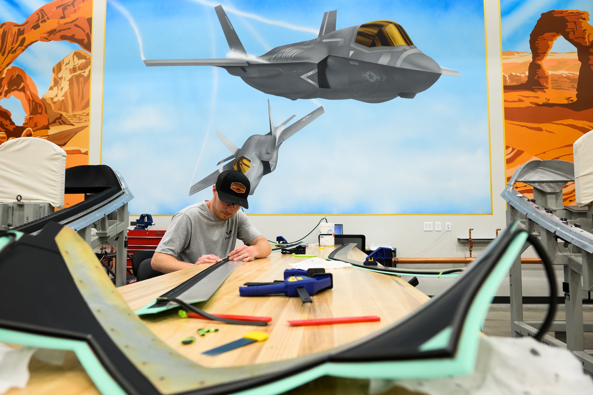 A man works on an F-35 part