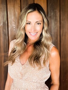 A smiling woman poses for a photo.