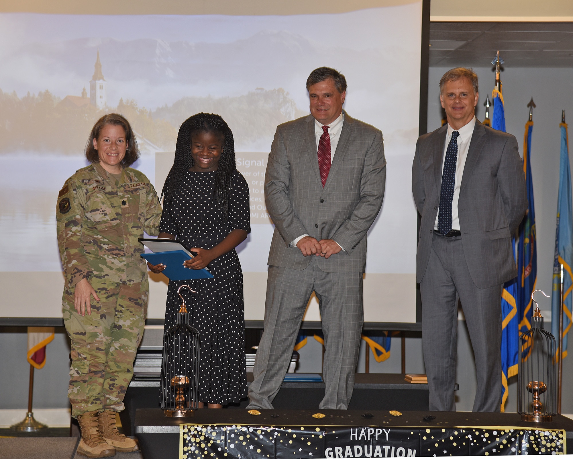 Columbus Air Force Base, 14th Flying Training Wing, Force Support Squadron, Miss., Project Search, graduates it's first students on 23 May 2023 at the CAFB Event Center. US Air Force Lieutenant Colonel Tiffany Sellers, Commander of the 14th Logistics Readiness Squadron, Mr Sam Allison, Superintendent Lowndes County School District and Mr. Chris Howard, Executive Director Miss. Department of Rehabilitation Services, present graduate, Makyia Bibbs, her certificate.