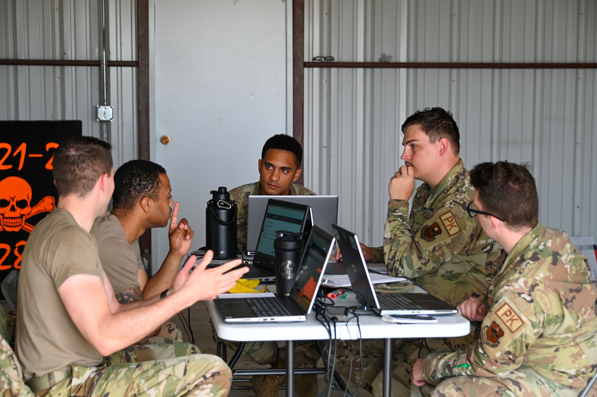 Airmen from the 97th Contracting Squadron participate in a deployment exercise at Altus Air Force Base, Oklahoma, May 18, 2023. The simulated deployed environment was established at Camp Little Bull, a 97th Civil Engineering Squadron training site. (U.S. Air Force photos by Senior Airman Kayla Christenson)