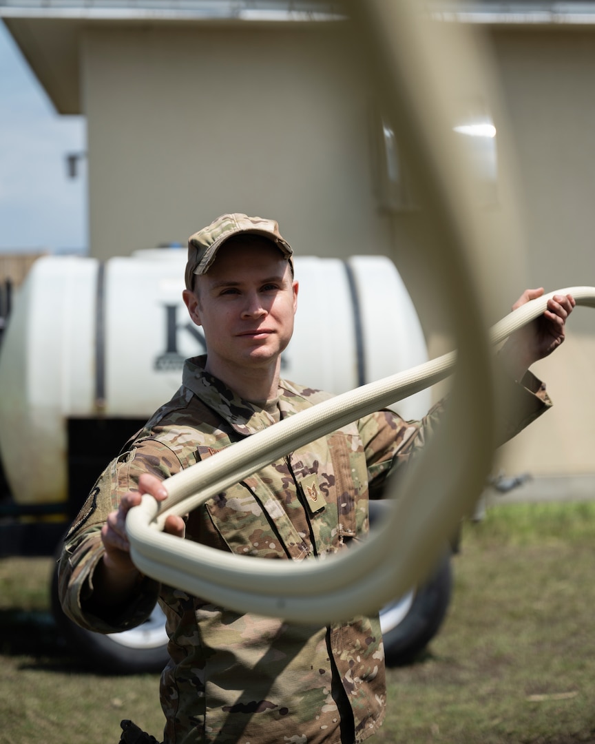 Civil engineer holds tubing