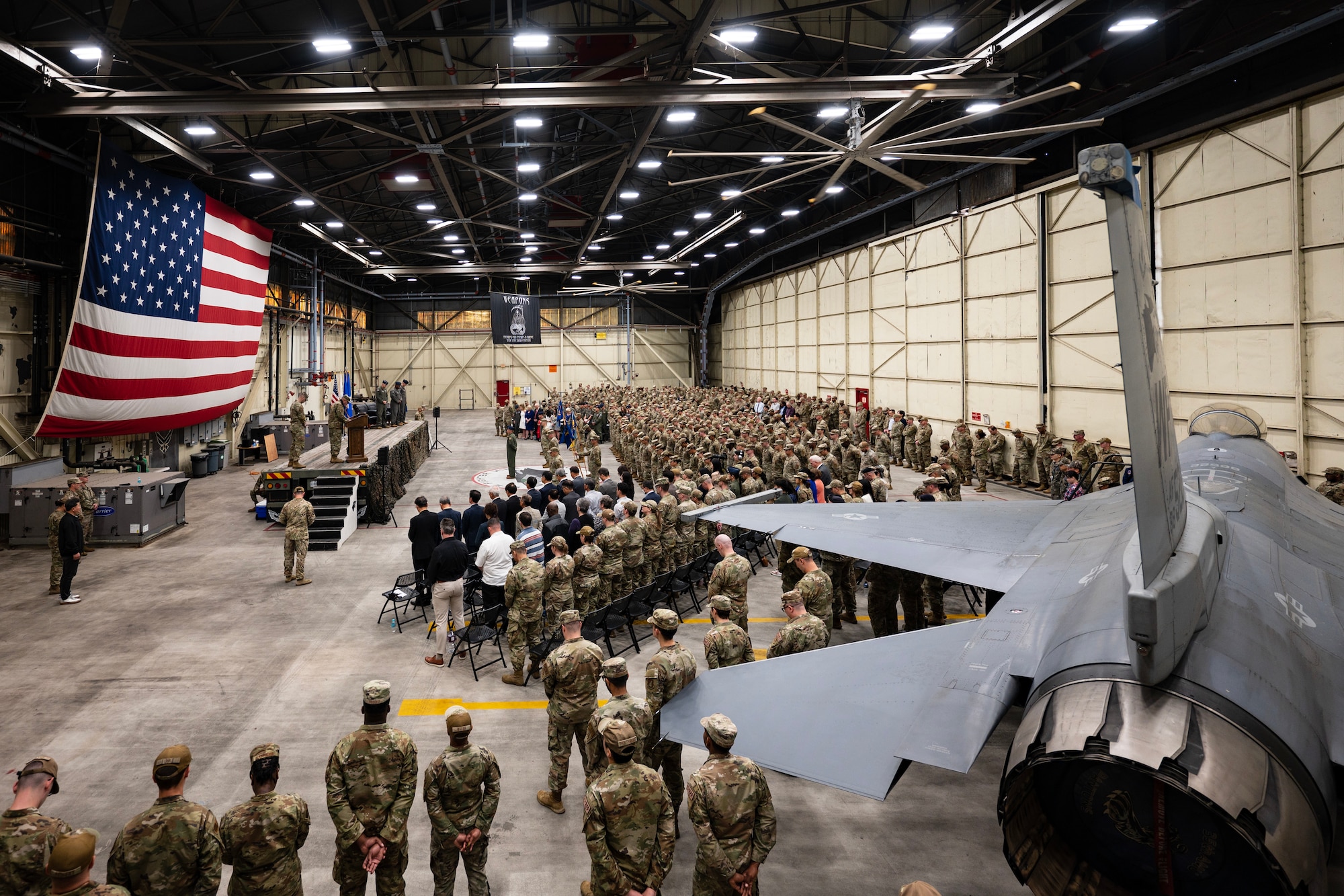 Airmen observe as change of command ceremony commences.