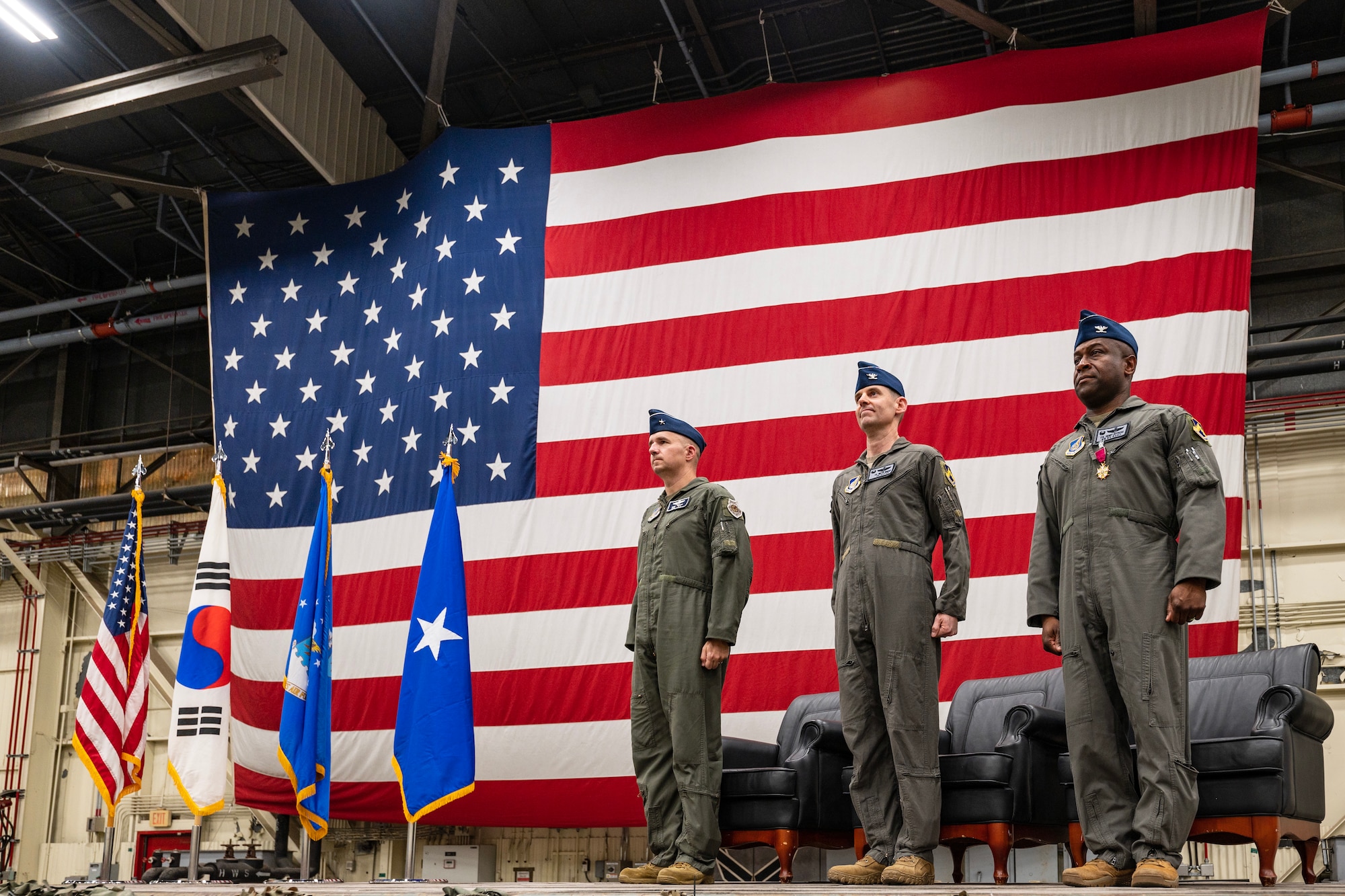Airmen stand at attention during change of command ceremony.