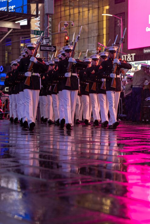 The Marine Corps Silent Drill Platoon performs at Times Square, N.Y. during Fleet Week New York (FWNY), May 24, 2023. More than 3,000 service members from the Marine Corps, Navy and Coast Guard and our NATO allies from Great Britain, Italy and Canada are engaging in special events throughout New York City and the surrounding Tri-State Region during FWNY 2023, showcasing the latest capabilities of today’s maritime services and connecting with citizens. The events include free public ship tours, military static displays, and live band performances and parades. (U.S. Marine Corps photo by Sgt. Juan Carpanzano)