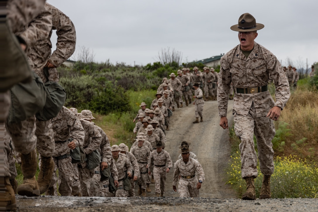 U.S. Marine Corps recruits with India Company, 3rd Recruit Training Battalion, march in formation to the confidence chamber at Marine Corps Base Camp Pendleton, Calif. May 23, 2023. The confidence chamber trains recruits how to properly use the M40 gas mask and respond to potential chemical and biological threats. (U.S. Marine Corps photo by Lance Cpl. Janell B. Alvarez)