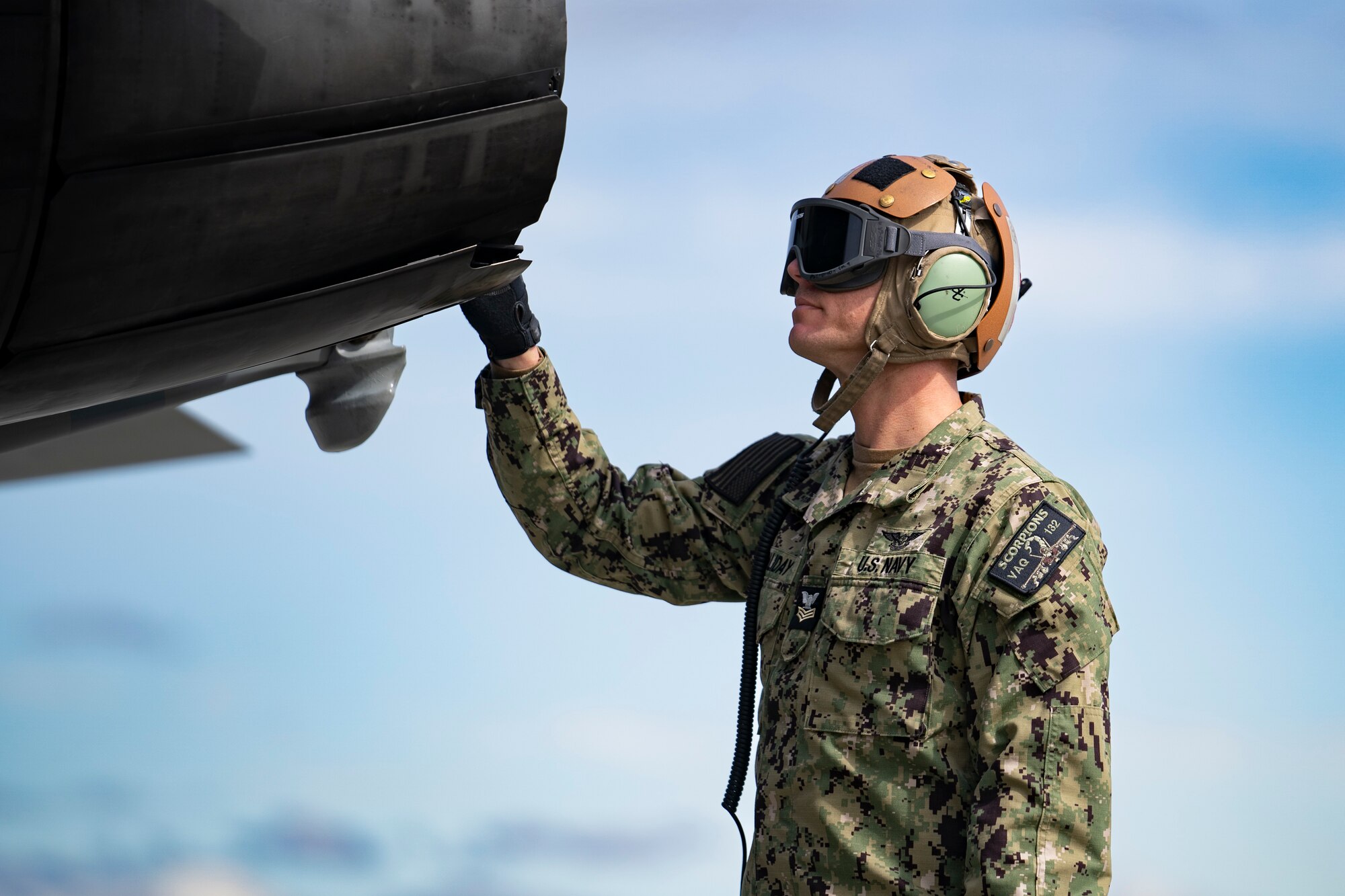 U.S. Navy Aviation Machinist's Mate 1st Class Corey Holliday, assigned to Electronic Attack Squadron (VAQ) 132, inspect an EA-18G “Growler” during Northern Edge 23-1 exercise at Joint Base Elmendorf-Richardson, Alaska, May 11, 2023