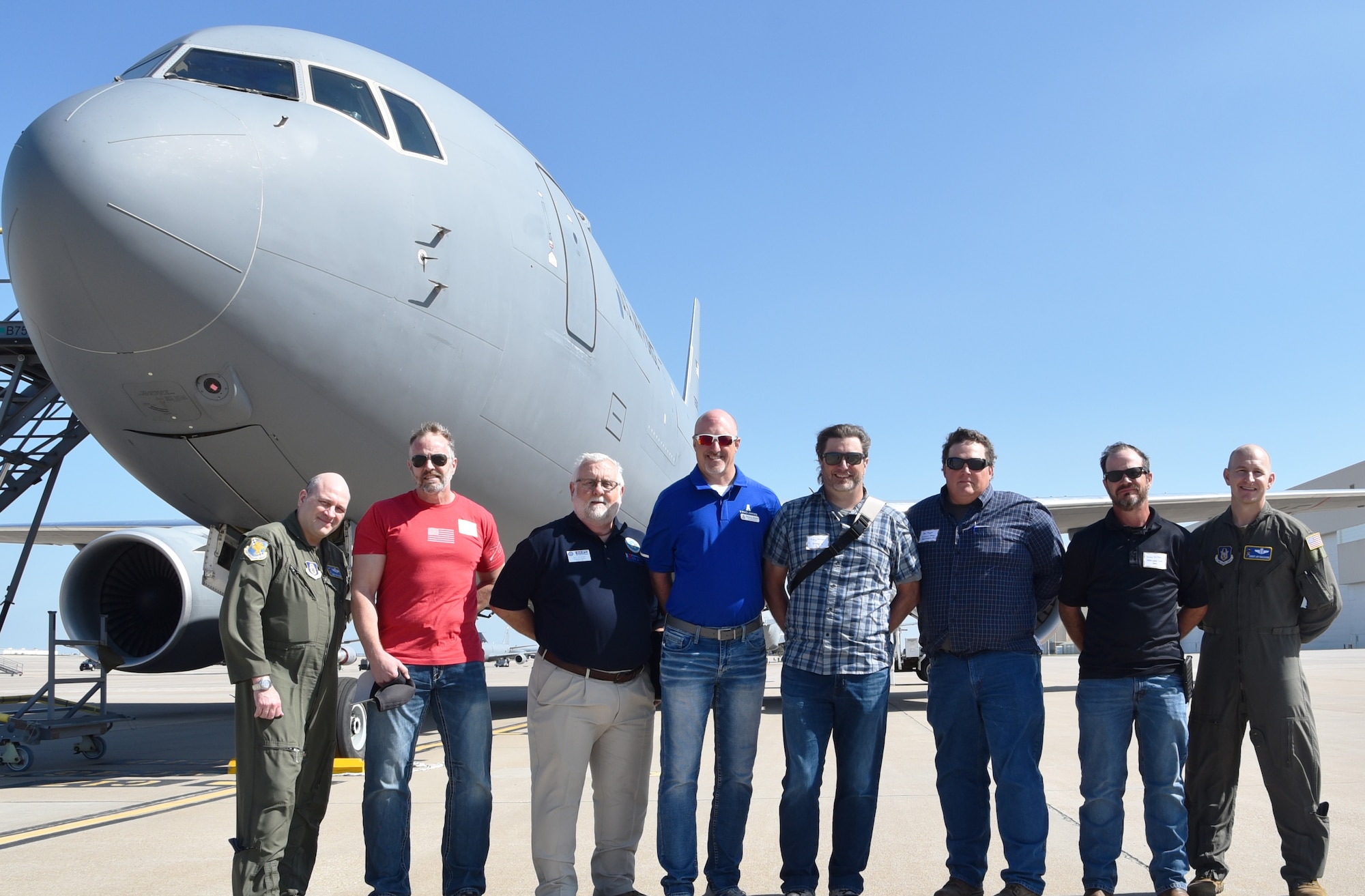 Civilian employers of 931st Air Refueling Wing traditional reservist Airmen pose with the and 18th Air Refueling Squadron KC-46A Pegasus aircrew and Employer Support of the Guard and Reserve (ESGR) representative Jim Wishart before an ESGR-sponsored flight in front of a KC-46A pegasus.