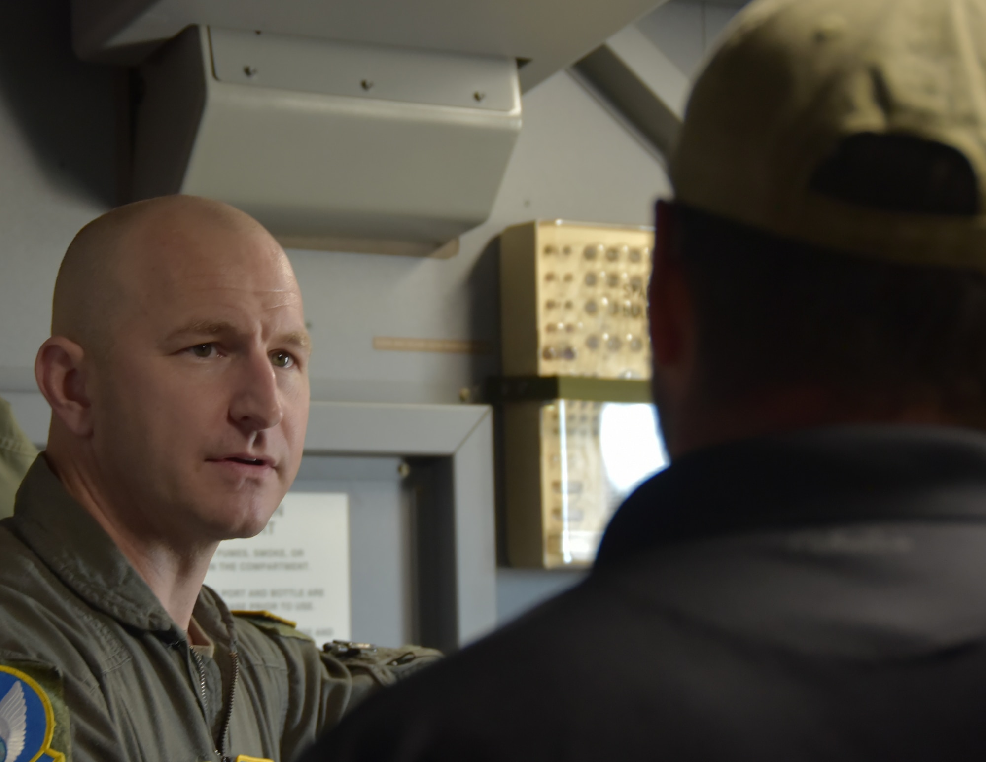 Chief Master Sgt. Jay Guldjord, 18th Air Refueling Squadron, 18th Air Refueling Squadron boom operator and chief enlisted manager, goes over the KC-46A boom capabilities with one of five civilian employers of a 931st Air Refueling Wing traditional reservist during an Employer Support of the Guard and Reserve (ESGR)-sponsored flight.