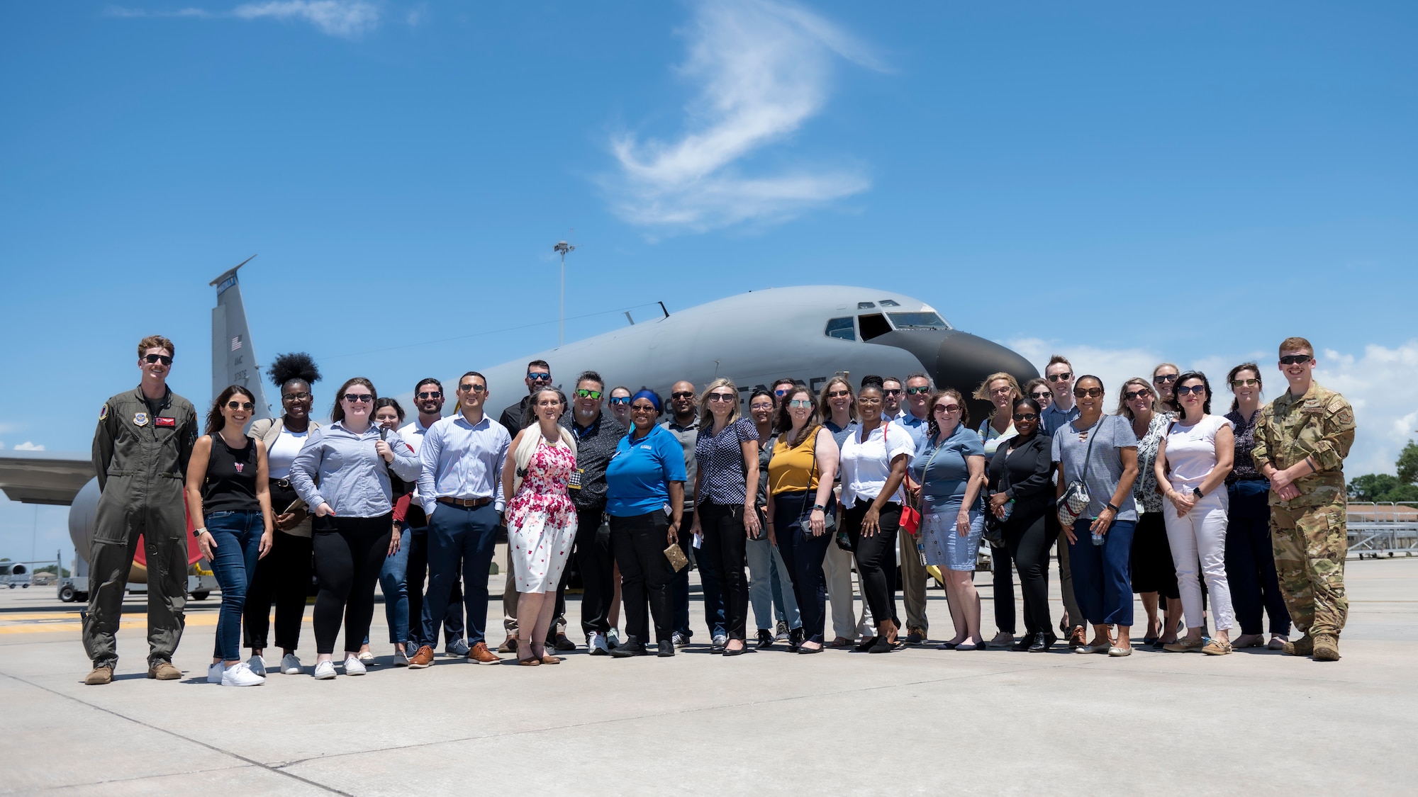 Civic leaders from the Tampa Bay Chamber Military Advisory Committee pose for a photo with service members assigned to the 6th Air Refueling Wing near a KC-135 Stratotanker at MacDill Air Force Base, Florida, May 18, 2023. The civic leaders toured the base to gain a better understanding of the 6th ARW mission and the different roles associated with aviation. (U.S. Air Force photo by Senior Airman Lauren Cobin)