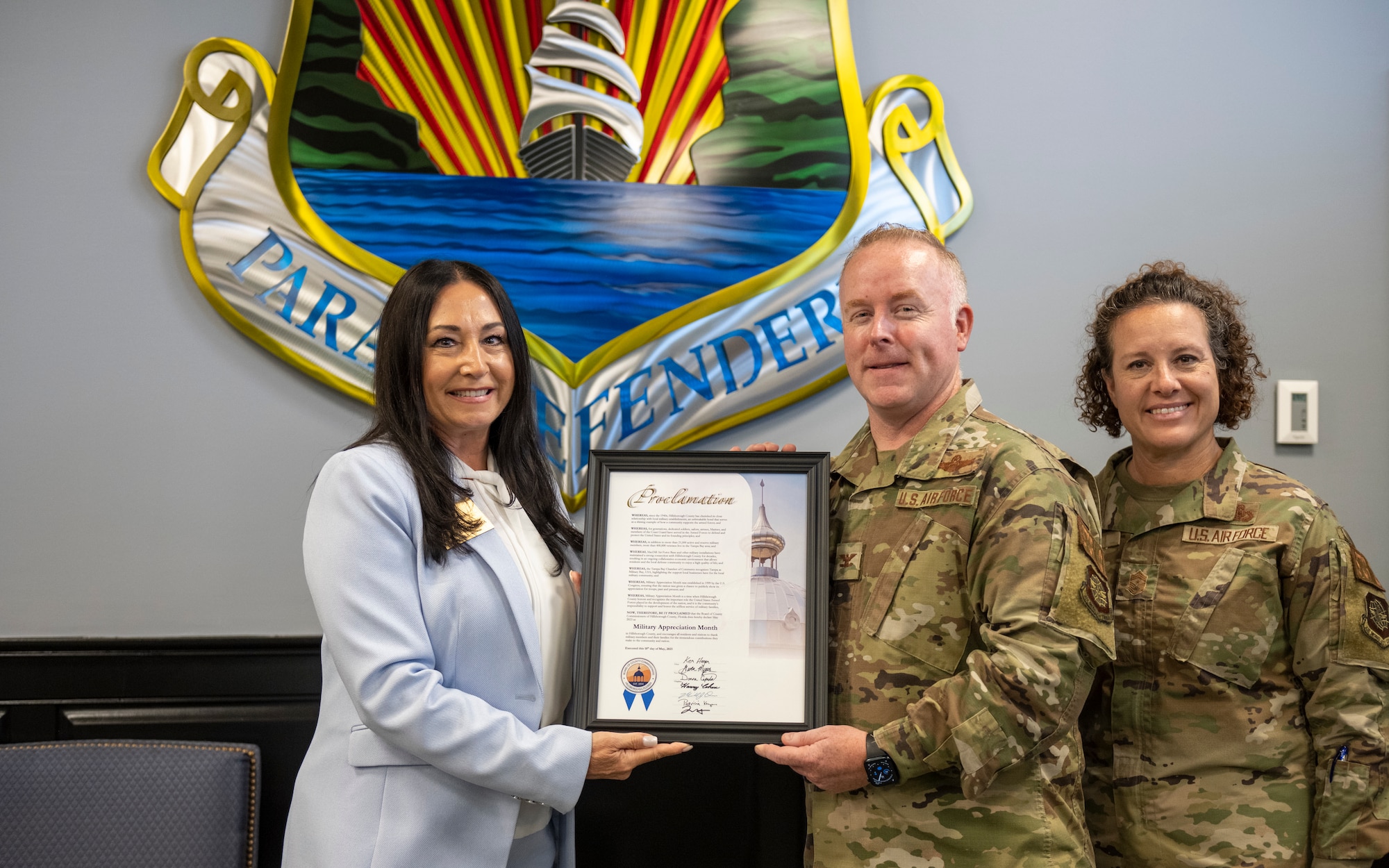 From left, Donna Cameron-Cepeda, Hillsborough County Commissioner, Col. Adam Bingham, 6th Air Refueling Wing commander, and Chief Master Sgt. Shae Gee, 6th ARW command chief, pose for a photo commemorating May as Military Appreciation Month at MacDill Air Force Base, Florida, May 18, 2023. The county commissioner joined civic leaders with the Tampa Bay Chamber Military Advisory Committee to gain a better understanding of the 6th ARW mission and the different roles associated with aviation. (U.S. Air Force photo by Senior Airman Lauren Cobin)