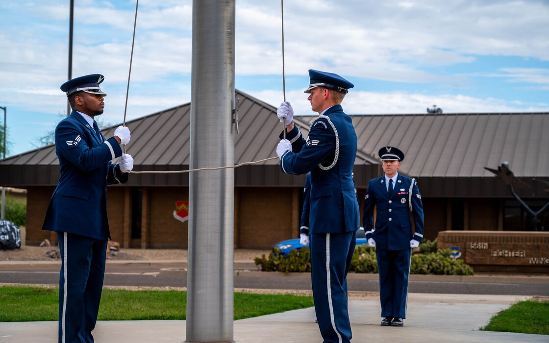 Members of the Luke Air Force Base Honor Guard lower the U.S. flag, May 19, 2023, at Luke AFB, Arizona.