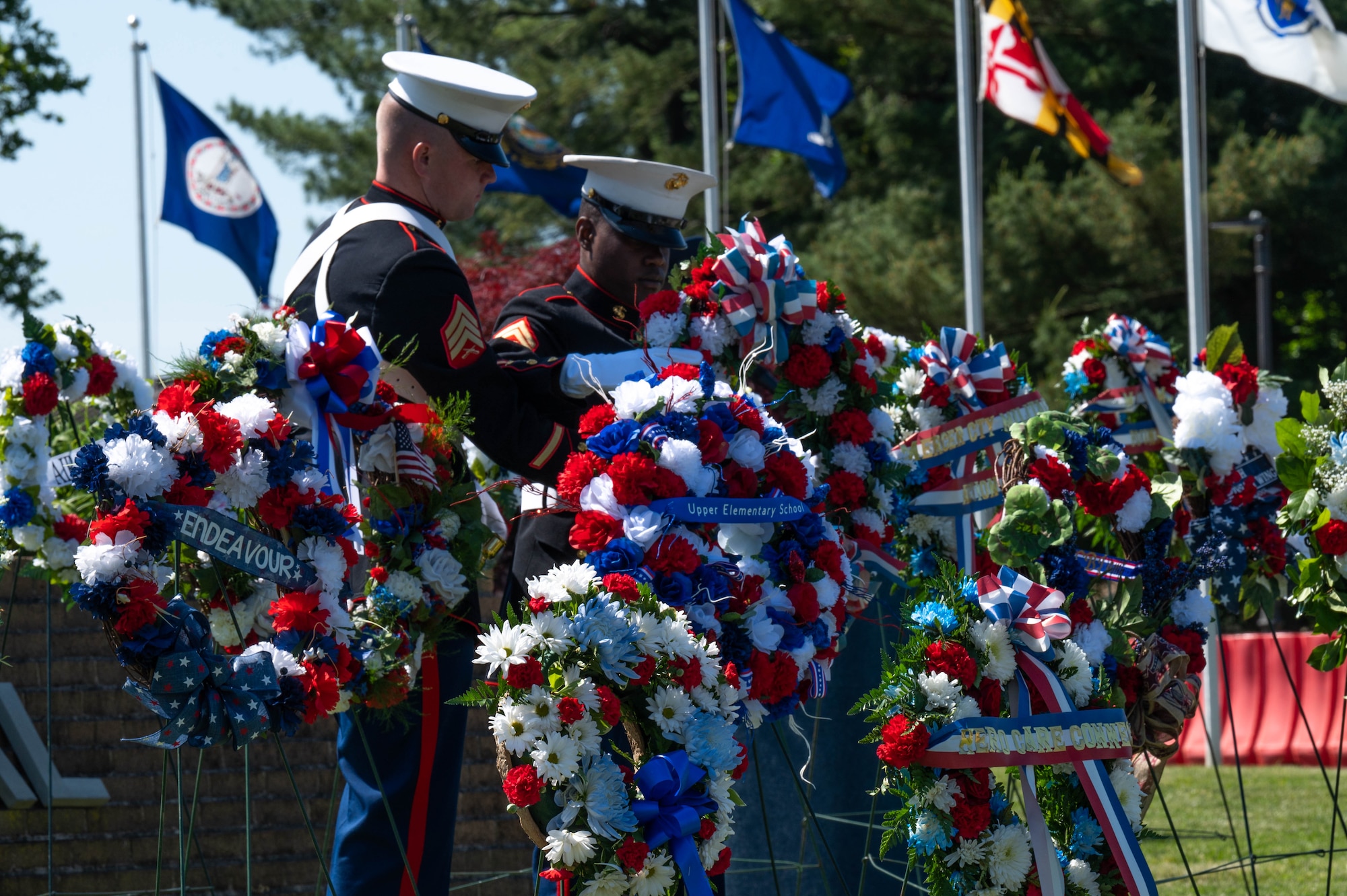 Service members display wreaths during the 2023 Parade of Wreaths Ceremony at Joint Base McGuire-Dix-Lakehurst, N.J. May 25, 2023. The event honors service members and police personnel who have given their lives in the line of duty. (U.S. Air Force photo by Senior Airman Faith Iris MacIlvaine)