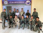 Armed Forces of the Philippines Naval Special Warfare Operators pose for a photo with members of U.S. Coast Guard Maritime Security Response Team West (MSRT West) after conducting close-quarters training during Balikatan 23 near El Nido, Philippines, April 13. 2023. MSRT West personnel operated in multiple locations throughout the Philippines, and provided maritime interdiction operations training alongside other U.S. and Philippine armed forces. (U.S. Coast Guard courtesy photo).