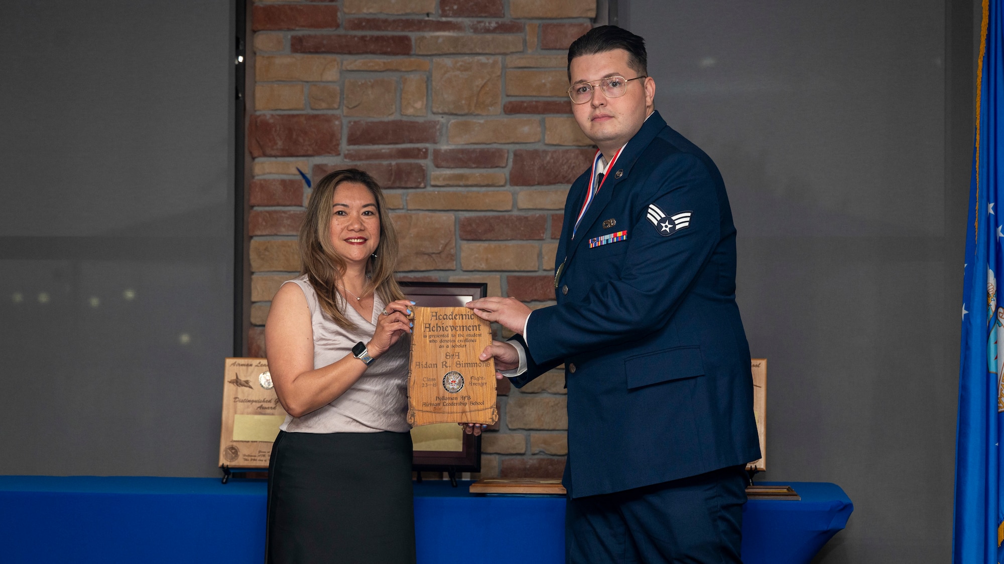 U.S. Air Force Aidan Simmons, Airman Leadership School graduate, accepts Academic Achievement Award during the graduation of ALS Class 23-E at Holloman Air Force Base, New Mexico, May 24, 2023.