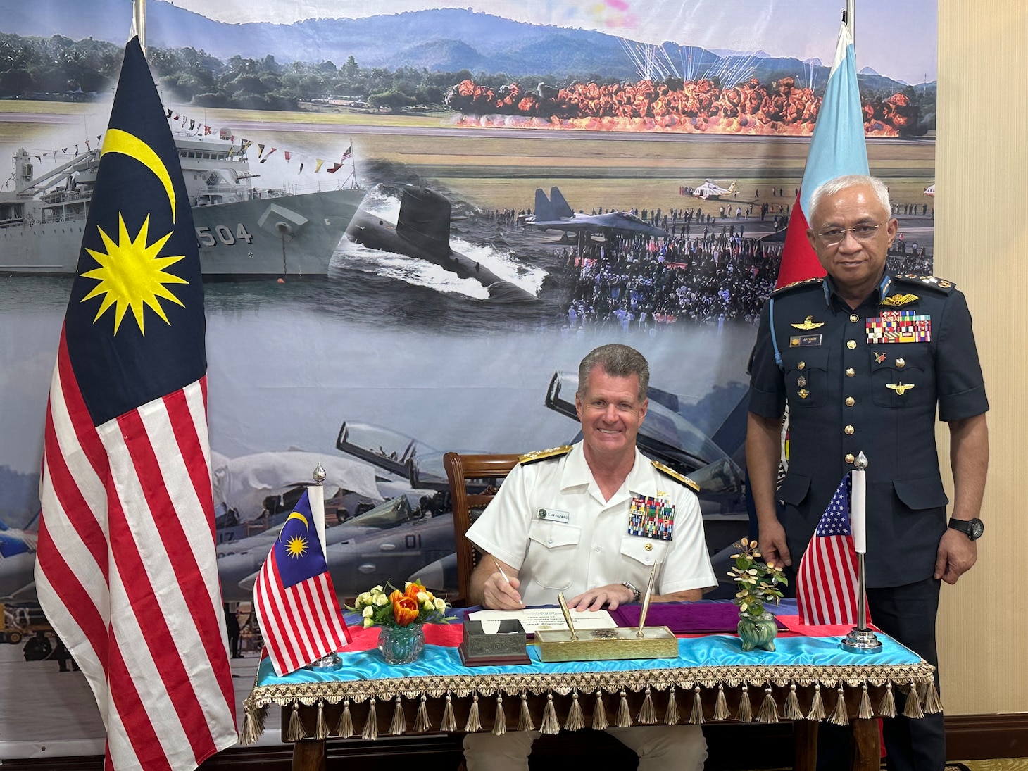 Adm. Samuel Paparo, commander, U.S. Pacific Fleet, and Gen. Tan Sri Affendi Buang, Malaysia’s chief of defence forces, pose for a photo during a bilateral meeting at Langkawi International Maritime and Aerospace Exhibition 2023 in Langkawi, Malaysia, May 24, 2023. The visit to Malaysia underscored the United States’ commitment to strengthening alliances and partnerships for an enduring resilient, free and open Indo-Pacific. (Photo courtesy of U.S. Navy)