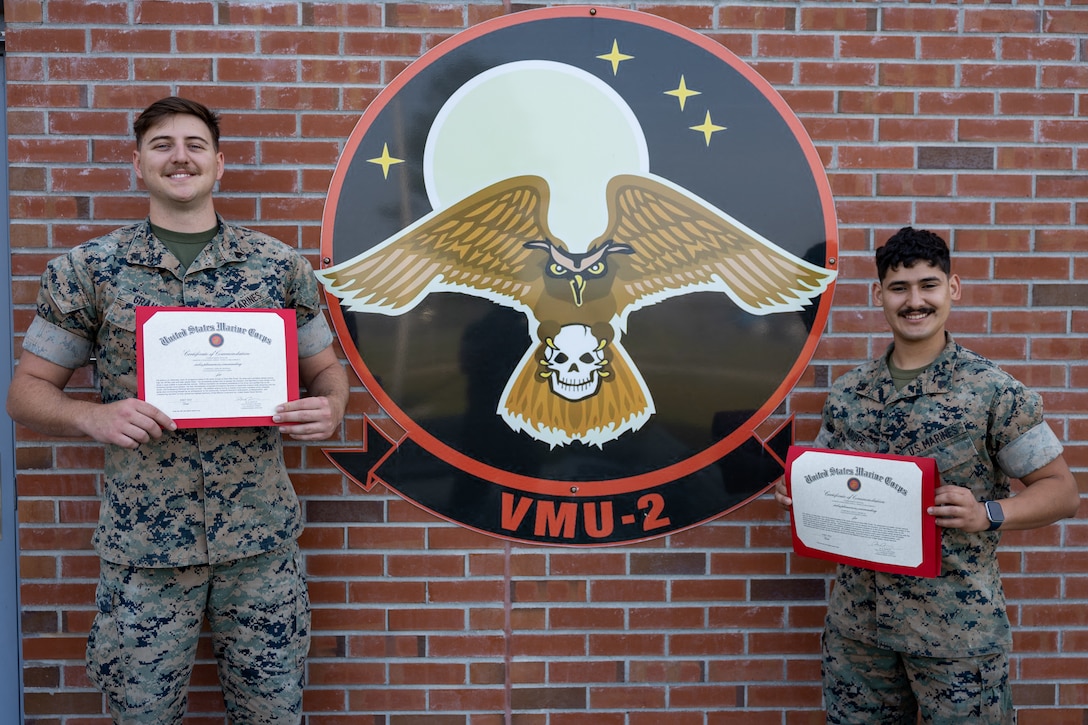 Graham and Arispe were awarded certificates of commendation for their actions in response to a vehicle crash while off duty. VMU-2 is a subordinate unit of 2nd Marine Aircraft Wing, the aviation combat element of II Marine Expeditionary Force. (U.S. Marine Corps photo by Lance Cpl. Elias E. Pimentel III)