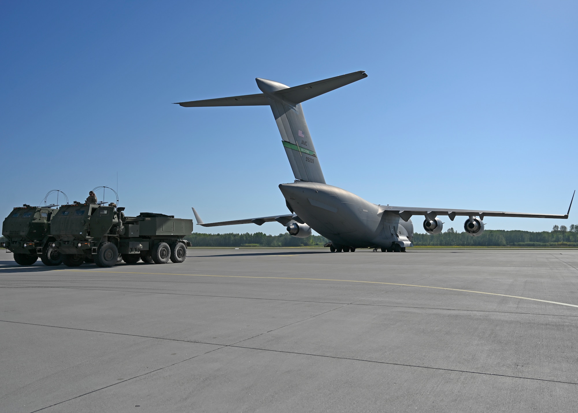 U.S. Army Soldiers with the 1st Battalion, 182nd Field Artillery Regiment prepare to load high mobility artillery rocket systems onto a C-17 Globemaster III assigned to the 62d Airlift Wing, during Exercise Swift Response in Lielvarde, Latvia, May 14, 2023. Swift Response is an exercise related to DEFENDER 23. DEFENDER 23 is a U.S. Army Europe and Africa-led exercise, supported by U.S. Air Forces in Europe – Air Forces Africa, focused on the strategic deployment of continental United States-based forces and interoperability with Allies and partners. Taking place from April 22 to June 23, DEFENDER 23 demonstrates the U.S. Air Force’s ability to aggregate U.S.-based combat power quickly in Europe; increase lethality of the NATO Alliance through the U.S. Air Force’s Agile Combat Employment; build unit readiness in a complex joint, multinational environment; and leverage host nation capabilities to increase USAFE-AFAFRICA’s operational reach. DEFENDER 23 includes more than 7,800 U.S. and 15,000 multi-national service members from various Allied and partner nations. (U.S Air Force photo by Senior Airman Callie Norton)