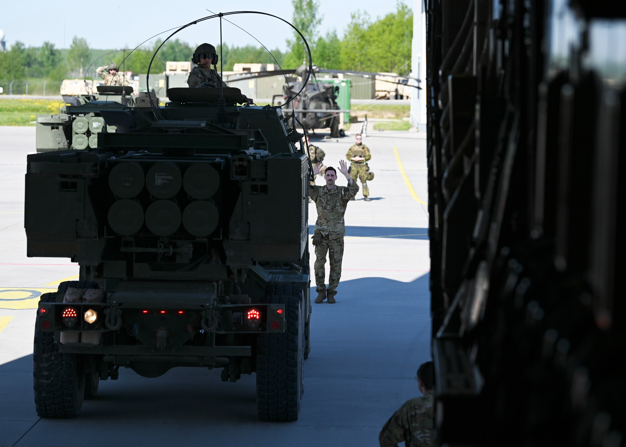 U.S. Air Force Staff Sgt. Tanner Sullivan, loadmaster with the 7th Expeditionary Airlift Squadron, and U.S. Army Sgt. Chandler Stoutenburg, high mobility artillery rocket systems chief with the 1st Battalion, 182nd Field Artillery Regiment, load a HIMAR onto a C-17 Globemaster III assigned to the 62d Airlift Wing, during Exercise Swift Response in Lielvarde, Latvia, May 14, 2023. Swift Response is an exercise related to DEFENDER 23. DEFENDER 23 is a U.S. Army Europe and Africa-led exercise, supported by U.S. Air Forces in Europe – Air Forces Africa, focused on the strategic deployment of continental United States-based forces and interoperability with Allies and partners. Taking place from April 22 to June 23, DEFENDER 23 demonstrates the U.S. Air Force’s ability to aggregate U.S.-based combat power quickly in Europe; increase lethality of the NATO Alliance through the U.S. Air Force’s Agile Combat Employment; build unit readiness in a complex joint, multinational environment; and leverage host nation capabilities to increase USAFE-AFAFRICA’s operational reach. DEFENDER 23 includes more than 7,800 U.S. and 15,000 multi-national service members from various Allied and partner nations. (U.S Air Force photo by Senior Airman Callie Norton)